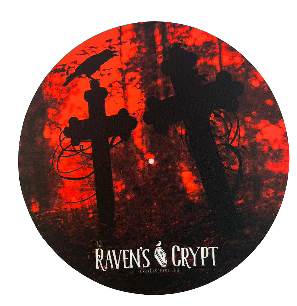 Gothic 12-inch vinyl slipmat showing a raven on a cemetery cross against a fiery red forest background, horror-themed design by The Raven’s Crypt.