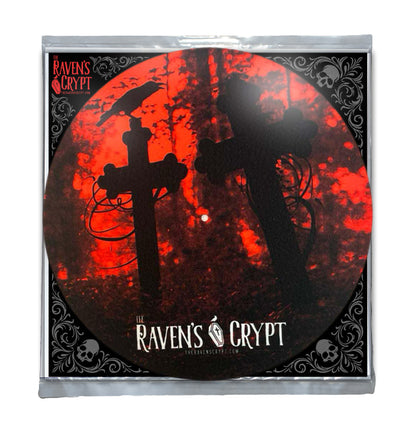 12-inch turntable slipmat featuring a raven perched on a graveyard cross with a red blood-moon sky, gothic design by The Raven’s Crypt.